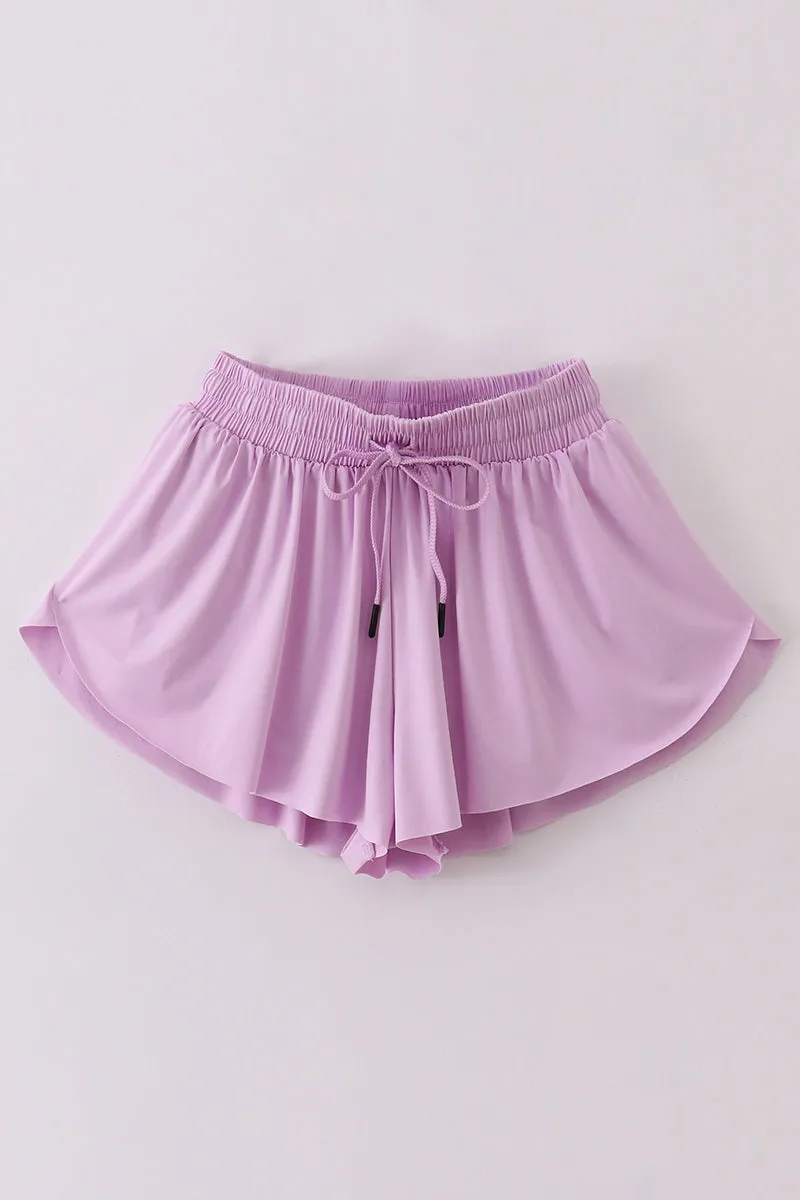 Purple woman sports shorts